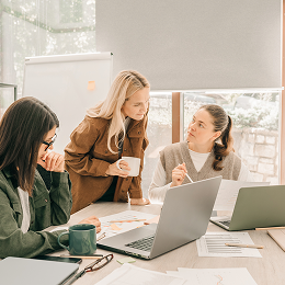 3 people seen in discussion at work