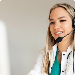 Woman with a headset working on a computer