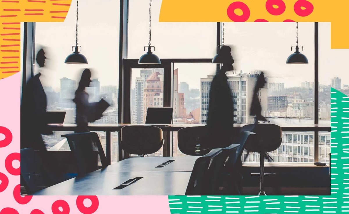 people silhouttes against office window